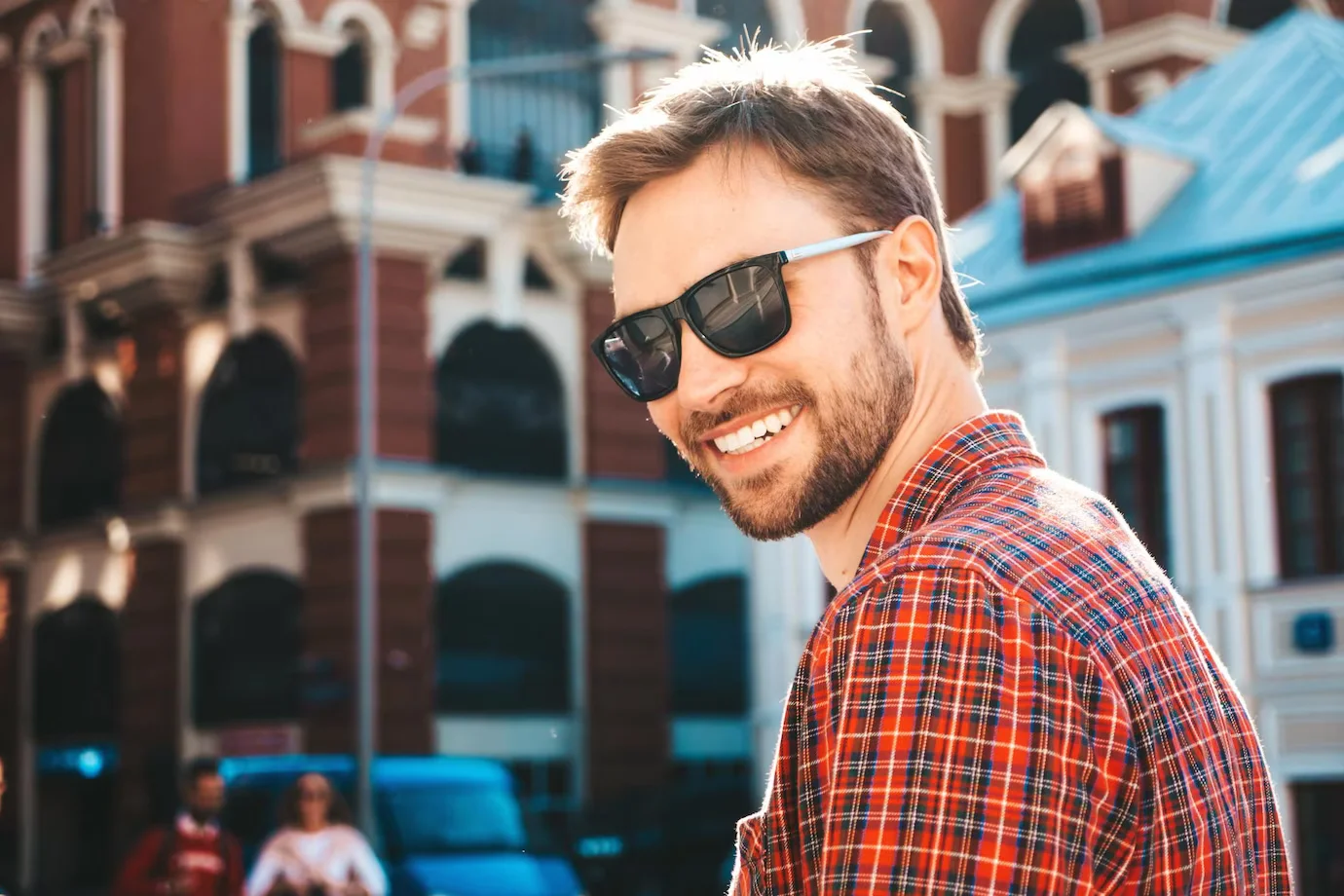 Man in sunglasses outdoors in city